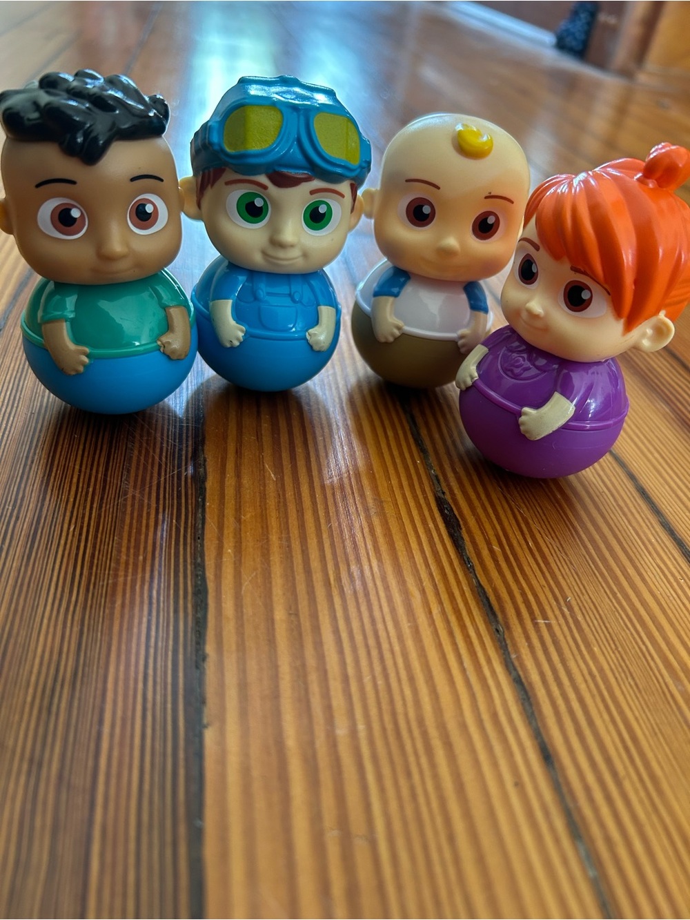 Cocomelon Wobble Toy Set of four- Purple, Blue, Green, Brown